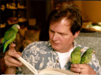 Reading at home with my parakeets